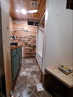 Exhaust fan, glass shower doors, cedar ceiling