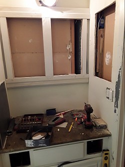 double medicine cabinets and a cubby with marble top