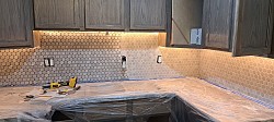 Backsplash being grouted