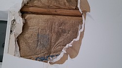 Water pooled behind the paint filling it like a balloon tell it popped