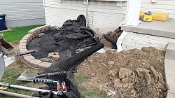 Front flower beds with full drainage and down spout tide in and cleanout. geogrid for extra support.