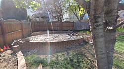 Clean and safe as long as you don't step off. Can't tell but the wall actually ties into the flower bed wall on the left making it all one.